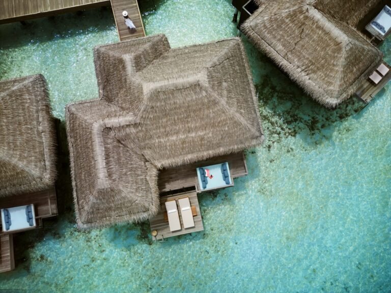 Anantara_Veli_Maldives_Resort_Accomodation_Aerial_Deluxe_Over_Water_Villa_with_Model-min